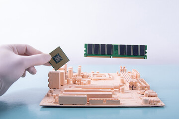 motherboard and a hand holding a microprocessor on a blue background in paint