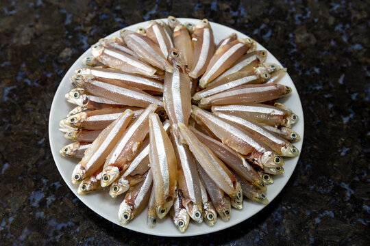 Raw fish,A manjuba, pititinga, ginga or manjubinha (Anchoviella lepidentostole), tropical freshwater fish. 