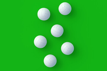 Strewn volleyball balls on green background. Sports equipment. International tournament. Championship winner. Training in a sports school. Indoor, outdoor games. Flat lay. 3d render