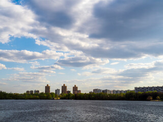 View of the city with clouds from the river