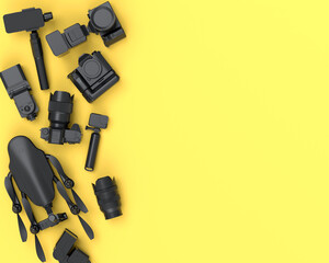 Fototapeta premium Top view of monochrome designer workspace and photography gear on yellow