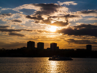 Picturesque View of the city on the river, Against The Sky During Sunset
