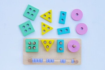 Colorful wooden toys for children on white background.