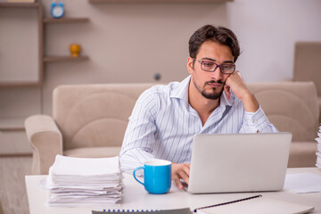 Young businessman employee working from home during pandemic