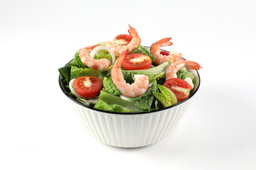 Mixed Vegetable Salad with Shrimp in a Bowl. Healthy green salad with shrimp and vegetables isolated on white background. Boiled shrimp. Healthy food. Seafood.