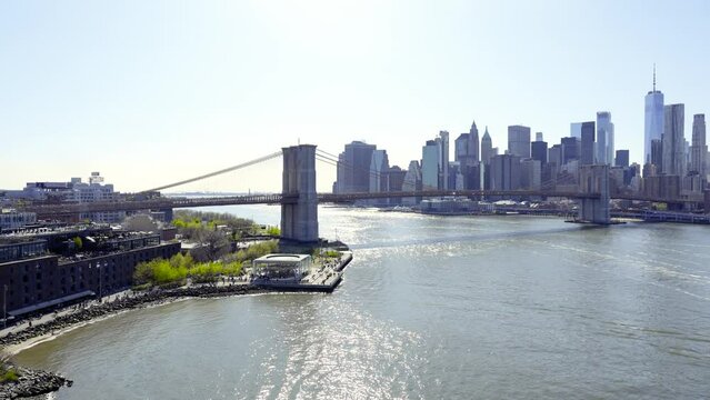 New York City skyline with skyscrapers. Brooklyn bridge over East River connecting Manhattan and Brooklyn
