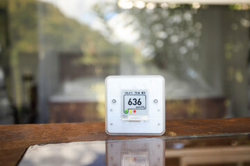 CO₂ sensor monitor. Indoor air quality sensor. Healthy work environment. Work control proper ventilation in your levels airflow in the room. Carbon dioxide levels and airflow. Smart home