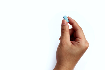 Hand with PrEP pill. HIV prevention