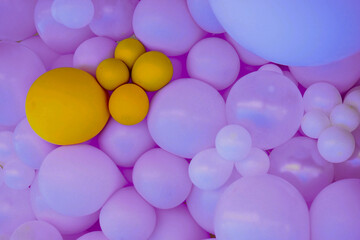 balls of blue or purple color, composition on the wall at a presentation or holiday 