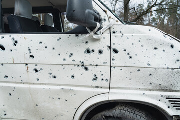 Shot car with a white flag. Bucha city. Ukraine