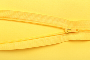 Stylish zipper on yellow background
