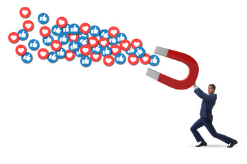 Businessman attracting likes with large magnet
