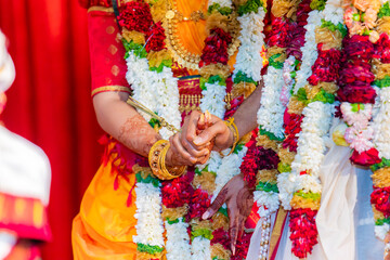 Fototapeta na wymiar Indian Hindu married couple's holding hands close up