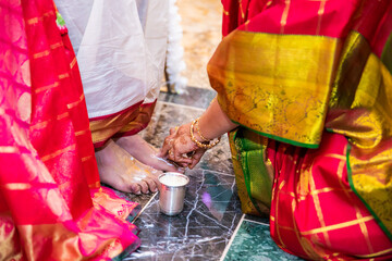 Indian Hindu wedding ceremony and rituals bride and groom's feet close up