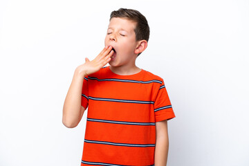 Little boy isolated on white background yawning and covering wide open mouth with hand