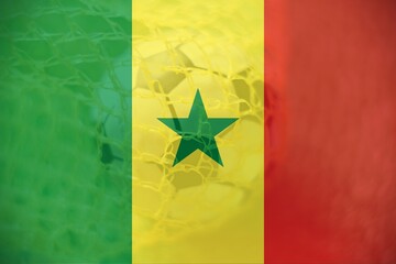 Senegla flag with Soccer ball in goal as background, sport and success business concept.