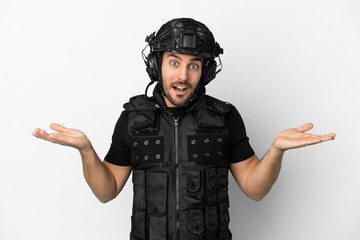 Young caucasian swat isolated on white background with shocked facial expression