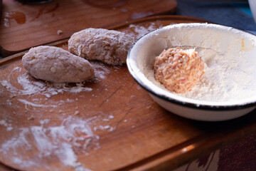 Cooking cutlets. Minced meat is ready for frying. Cooking at home. Close up of hands