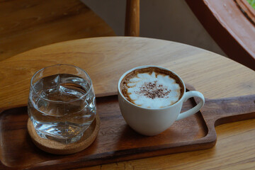 Hot cappuccino in a warm atmosphere.