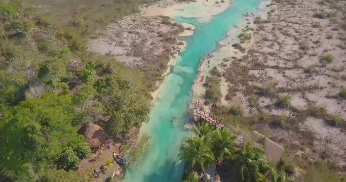 Exotic View on Los Rapidos lagoon with People in Mexico, Low Aerial Dolly in