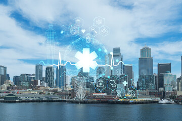 Seattle skyline with waterfront view. Skyscrapers of financial downtown at day time, Washington, USA. Health care digital medicine hologram. The concept of treatment and disease prevention