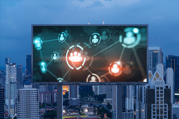 World planet Earth map hologram and social media icons on billboard over night panoramic city view...