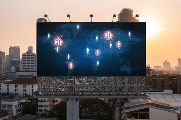 Glowing hologram of Earth planet map on billboard over aerial panoramic cityscape of Bangkok at sunset. The concept of international business in Southeast Asia.
