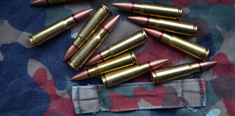 Ammunition 7,62x39 with camo background