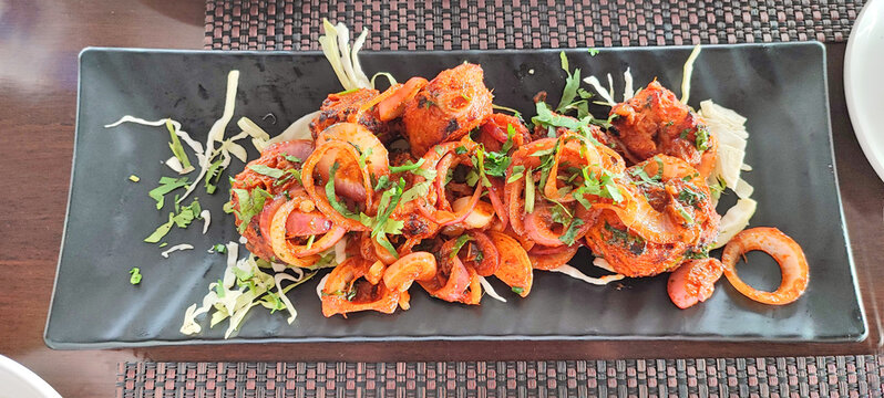 Soya tandoori tikka in black plate on dark background