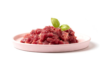 Diced pork or beef meat. Animal feed. Fresh meat for cooking.