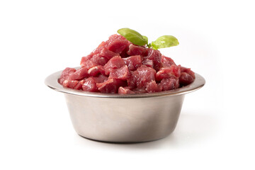 Diced pork or beef meat in a bowl. Wet animal feed.