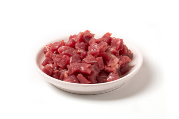 Diced pork or beef meat. Animal feed. Fresh meat for cooking.