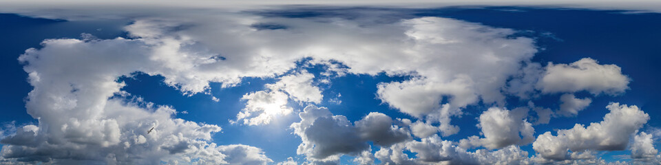 Blue sky panorama with puffy Cumulus clouds. Seamless hdr pano in spherical equirectangular format. Sky dome or zenith for 3D visualization, game and sky replacement for aerial drone 360 panoramas.