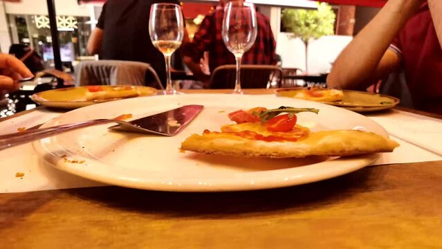 pizza eating fast  by two frieds in a restaurant in timelapse video
