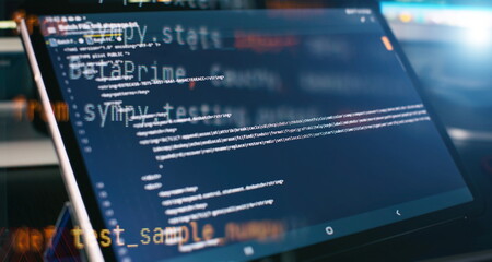 Modern tech. PHP syntax highlighted. Writing programming functions on laptop. Big data and Internet...