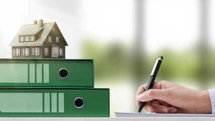 Customer signing a house purchase agreement