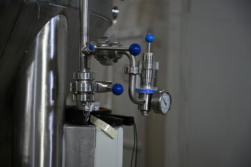 Photo of control valves in equipment with a pressure gauge