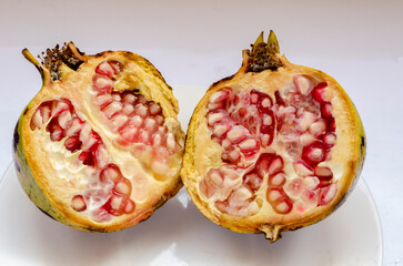 Pomegranate Halves On White Background