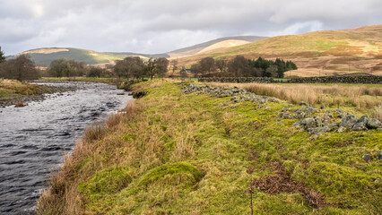 Close up of dredged river rocks offering flood bank protection for fields