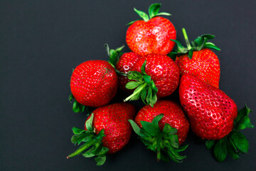 Strawberries juicy berries close-up isolate on a black background
