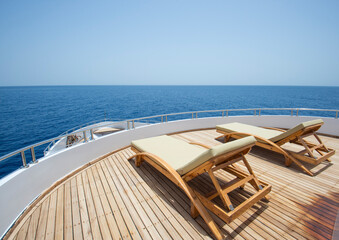 View from bow deck of luxury yacht with sunbeds