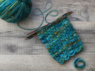 Beautiful handknit socks with a nice pattern knitted from handdyed sockwool, hot on the needles...