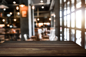 Empty top of wooden shelves on coffee shop ,tree front view background. For product display blur background