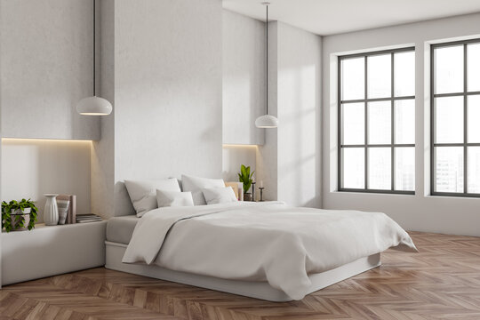 Corner view on bright bedroom interior with empty white wall © ImageFlow