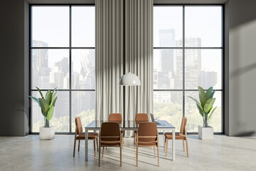 Fototapeta na wymiar Stylish living room interior with table and seats, panoramic window