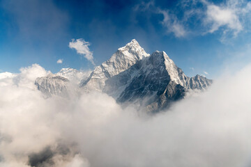 Awesome photo of a mountains in snow in a clouds, Nepal