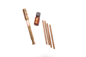 Alternative therapist applying moxibustion a traditional chinese medicine method. Doctor healing young patient with traditional asian medicine. Moxa stick alone. Extreme close up. Moxibustion.