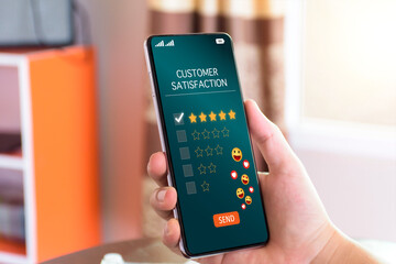 Customer satisfaction assessment concept. customer show smartphone screen send satisfaction rate five stars, send smiley emoji and hearts, satisfied smiley face, excellent service, customer be happy.