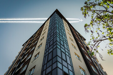 Airplane over building