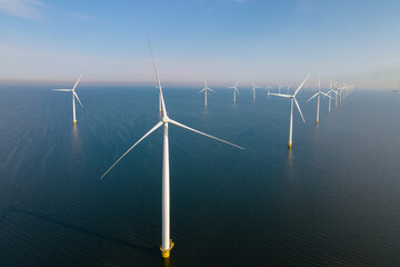 Offshore Windmill farm in the ocean Westermeerwind park, windmills isolated at sea on a beautiful...